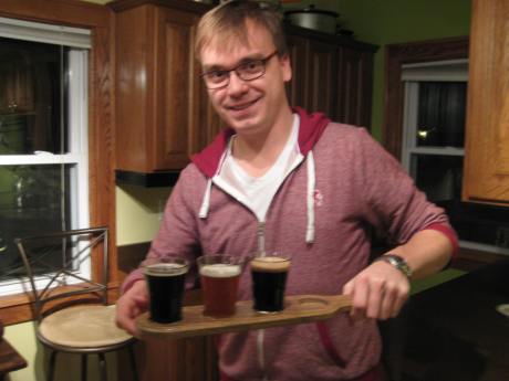 Kyle with home brew beer flight. Ready for a tasting.